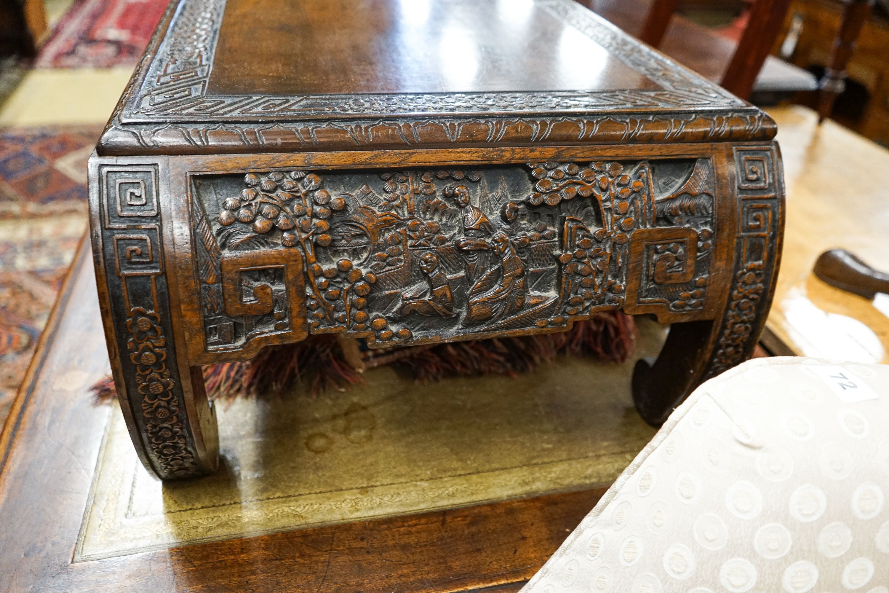 A Chinese rectangular carved top hardwood table, width 104cm, depth 46cm, height 29cm